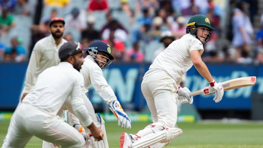All-round excellence: Cummins sets off for a run during his unbeaten knock of 61 on day four. 