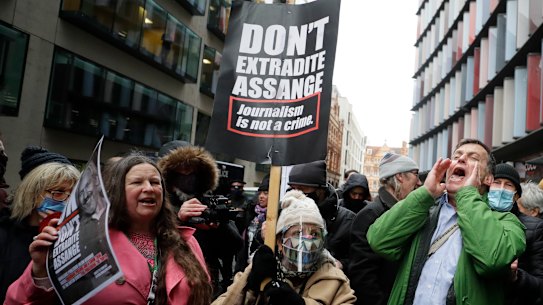 Julian Assange supporters celebrate after a ruling that he cannot be extradited to the United States, outside the Old Bailey in London.