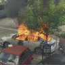 In this grab taken from video, a view of a car set on fire in the town of Zvecan, northern Kosovo.