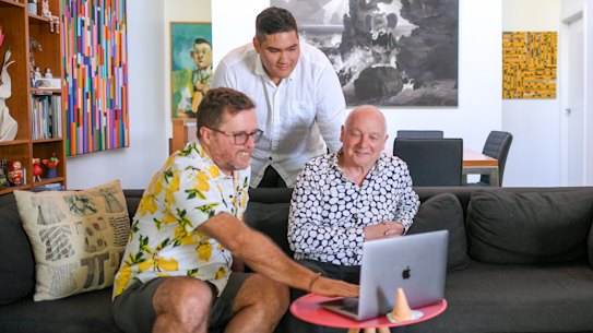 Denis Moriarty (right) and partner Brendan Shanahan (left) with their son John Nguyen at home. 