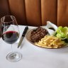 Steak frites is served with either bordelaise or bearnaise sauce and salad at Normandy Wine and Grill.