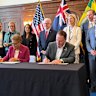 Los Angeles Mayor Karen Bass and Brisbane Lord Mayor Adrian Schrinner signing the sister city agreemeent in California.
