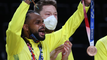 â€˜Rose goldâ€™: Mills celebrates with his bronze medal.