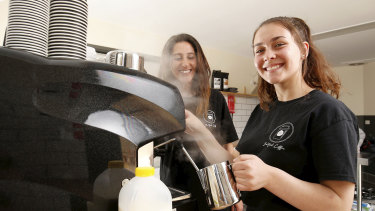 Amy Zerafa, 15, makes a coffee as her teacher Seral Fehmi looks on.