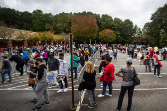 Hundreds of people wait in line for early voting in Marietta, Georgia, in 2020.