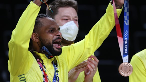 ‘Rose gold’: Mills celebrates with his bronze medal.