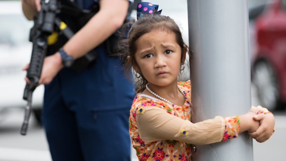 A young girl at Hagley College where relatives of the victims have gathered.