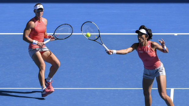 Stosur and Zhang cover the court at Melbourne Park.