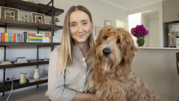 P&N Bank processing officer Emily Brown at home with her dog Tilly.