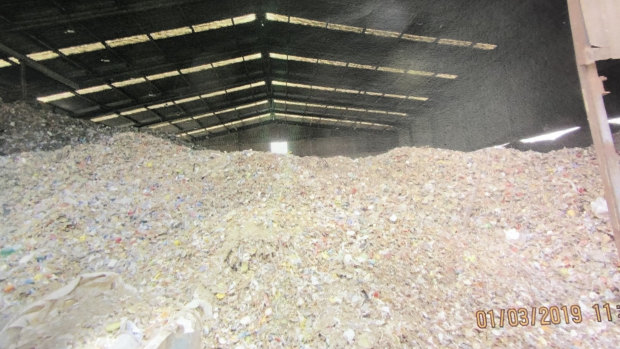 Mounds of waste at the glass sorting plant.