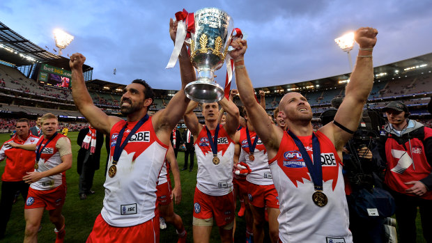Jarrad McVeigh (right) celebrates Sydney's 2012 AFL grand final win with co-captain Adam Goodes.