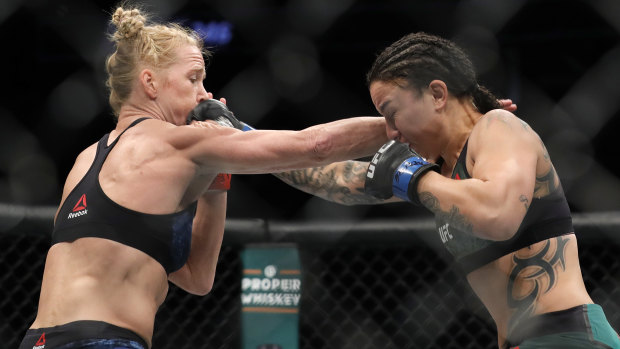 Trading blows: Holly Holm and Raquel Pennington during their bantamweight bout at UFC246.