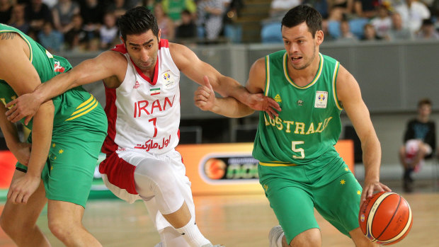 Gap closing: Jason Cadee under pressure from Aren Davoudichegani at Margaret Court Arena in Melbourne on Friday.