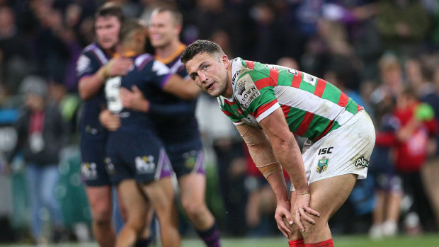 Hard night at the office: Sam Burgess takes in defeat after taking some serious punishment.