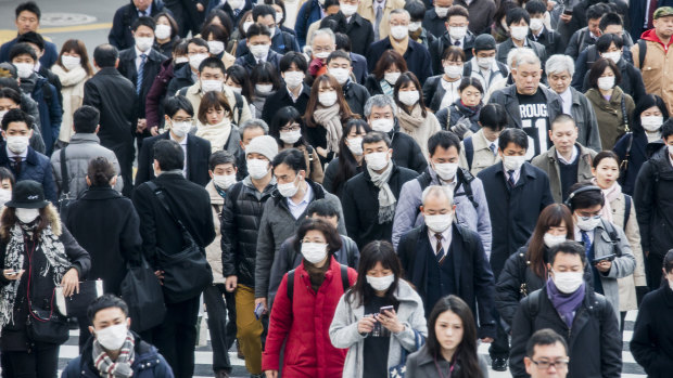 Commuters in the Shinjuku district of Tokyo. 