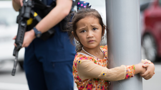 A young girl at Hagley College where relatives of the victims have gathered.