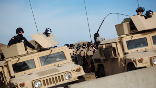 Police face off against protesters occupying a bridge  north of the Standing Rock Sioux Reservation in North Dakota in October 2016.