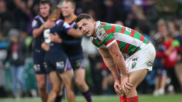 Hard night as the office: Sam Burgess takes in defeat after absorbing some serious punishment.