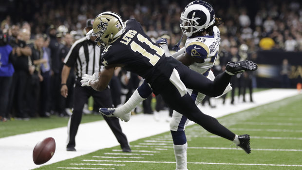 Moment of truth: New Orleans Saints wide receiver Tommylee Lewis works for a catch against Los Angeles Rams defensive back Nickell Robey-Coleman.