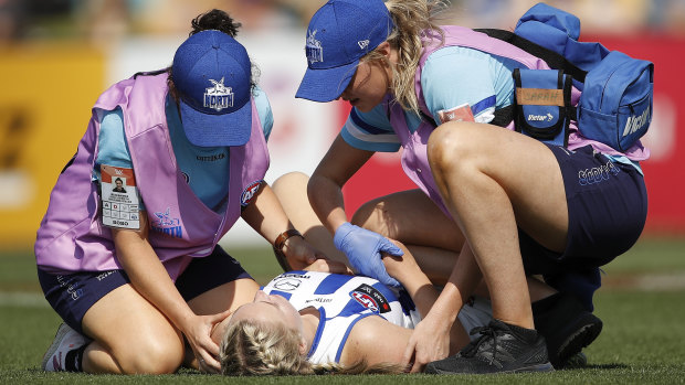 Daria Bannister of the Kangaroos lays injured on the turf.