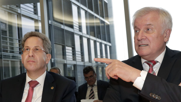 Hans-Georg Maassen, left, head of the German Federal Office for the Protection of the Constitution, and German Interior Minister Horst Seehofer, right, pictured on September 12.`