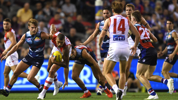 Quiet night: Lance Franklin breaks free from a ruck.