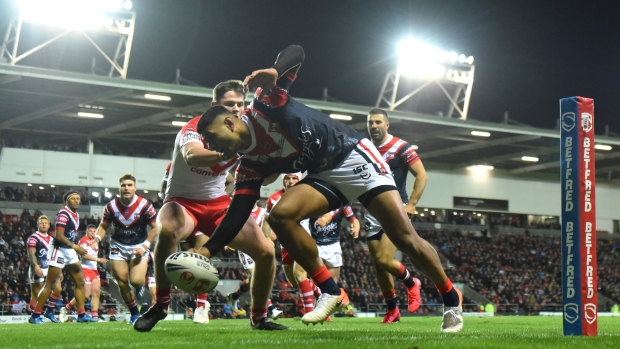 Daniel Tupou scores the Roosters' opening four-pointer.