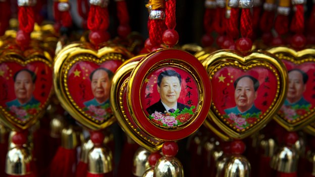 Souvenirs depicting Xi Jinping and the founder of the PRC, Mao Zedong.