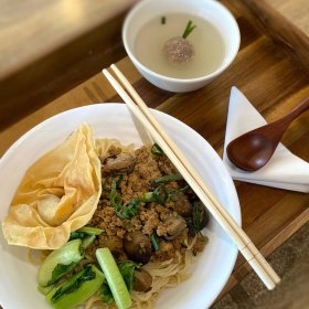 Noodles accompanied by bakso in broth at Batavia Corner.