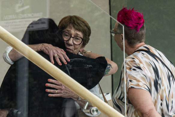 Cecilia Devine’s mother Kathy Pearson hugs friends of her daughter at the Coroners Court.