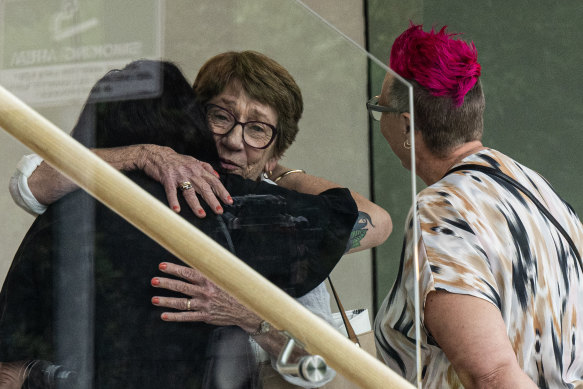 Cecilia Devine’s mother Kathy Pearson hugs friends of her daughter at the Coroners Court in March.