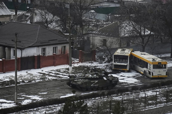 A Russian army tank seen moving through the outskirts of Mariupol. 