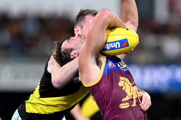 Rhys Mathieson is tackled by Dylan Grimes.
