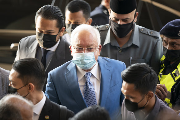 Former Malaysian prime minister Najib Razak, centre, arrives at Kuala Lumpur High Court in February.