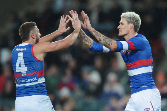 Marcus Bontempelli and Rory Lobb celebrate a goal. 