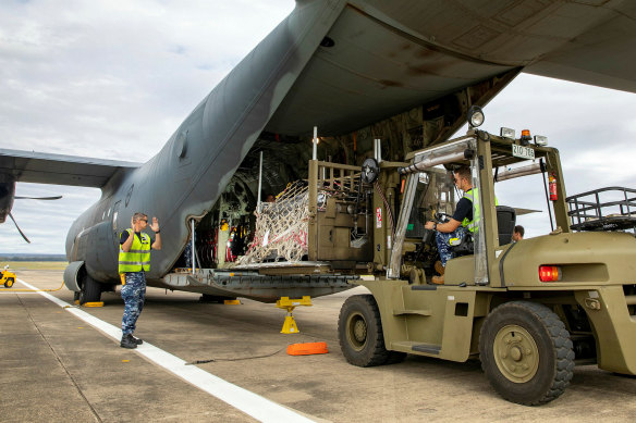 Humanitarian aid for Papua New Guinea being loaded onto a Hercules transport aircraft in 2021. 