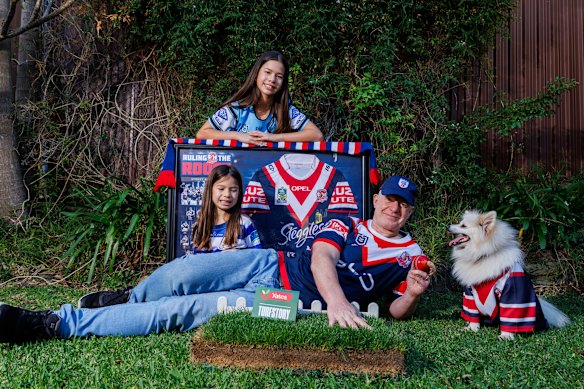 Roosters superfan Thomas Hayes with daughters Naomi and Nalani, and dog Snow. 