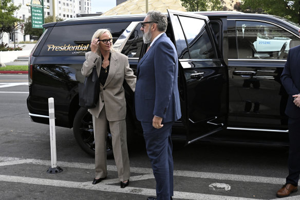 Elisabeth Murdoch, left, arrives at the Second Judicial District Court.