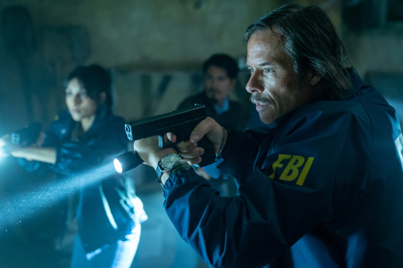 Guy Pearce, right, stars in the bloody action-thriller Memory.