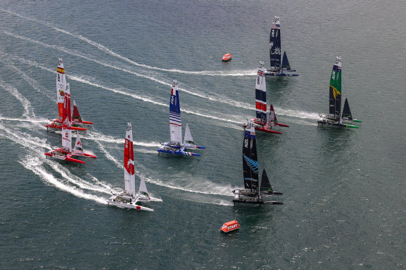 The SailGP F50 catamaran fleet in action during a practice race.