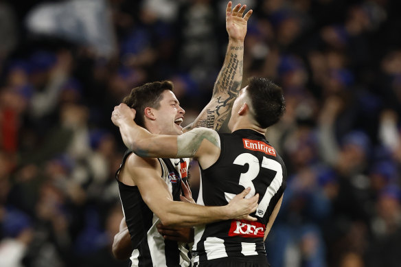 Jack Crisp and Brayden Maynard celebrate a telling Collingwood goal.