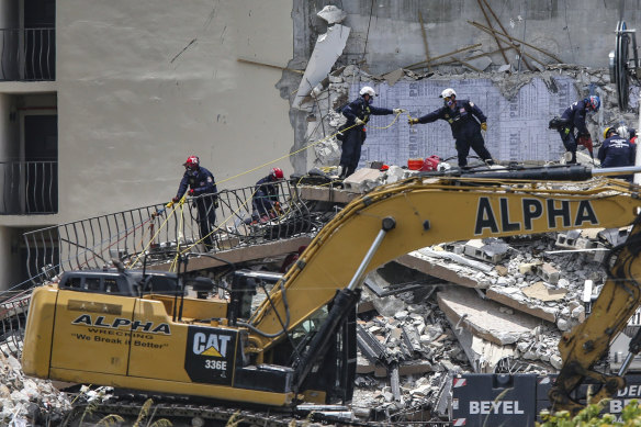 A Florida rescue team searches for survivors amid the rubble. 