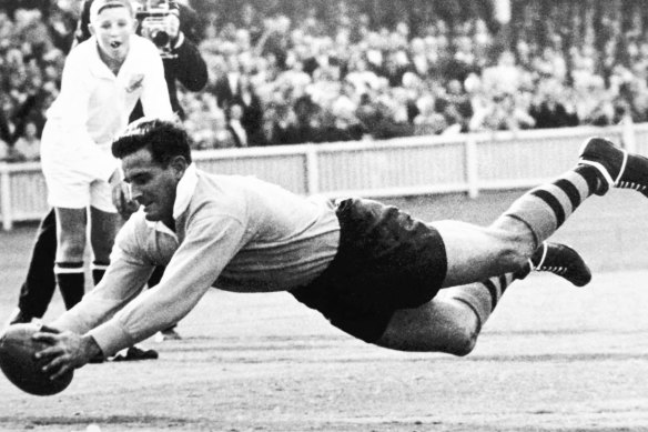 Australian rugby union footballer Jim Lenehan dives to score against South Africa at the SCG on June 19, 1965.