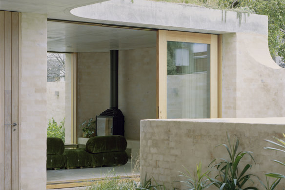 Large sliding doors leading to two courtyard gardens expand the home’s indoor “social areas”.