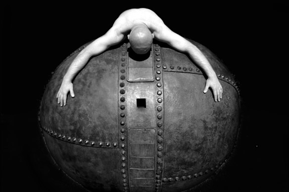 Greg Clark with his sculpture Toll Ton at the Footscray campus of Victoria University. The sculpture was part of the National Sculpture trail in 1996.