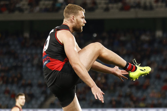 Jake Stringer of the Bombers kicks a goal during the round 20 AFL match between the Essendon Bombers and the North Melbourne Kangaroos at Marvel Stadium on July 31, 2022