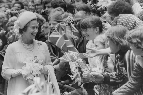 Jubilee smiles: A memorable moment for young children as the Queen walks through the city of London from St Paul’s Cathedral to the Guildhall in 1977.