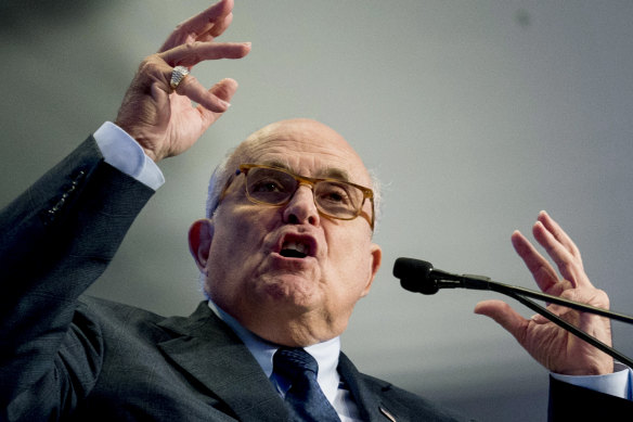 The two arrested men have been assisting a push by Rudy Giuliani, pictured, to get Ukrainian officials to investigate Joe Biden and his son.