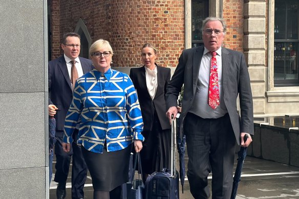 Senator Linda Reynolds arrives at court on Tuesday with her lawyer, Martin Bennett (right).