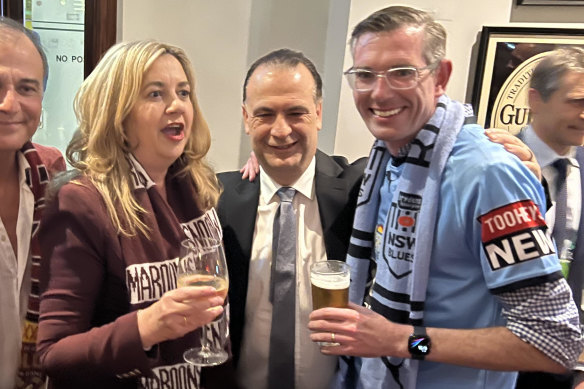 Queensland Premier Annastacia Palaszczuk and NSW Premier 
Dominic Perrottet walked down Caxton Street with Peter V’landys (centre) before Brisbane hosted the State of Origin decider.